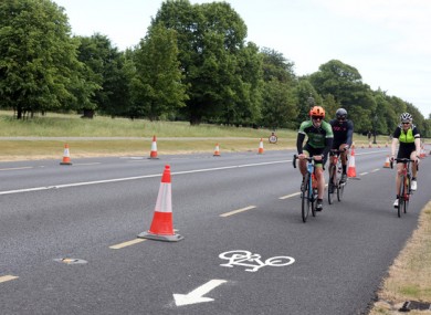 Cyclists last month using a bicycle lane in the Phoenix Park Dublin in place where cars used to park.
