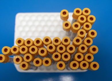 Test tubes to be used for blood samples sitting on a table at a coronavirus antibody testing programme.