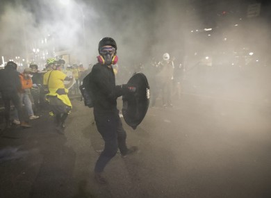 Tear gas fills the air outside the federal courthouse in Portland