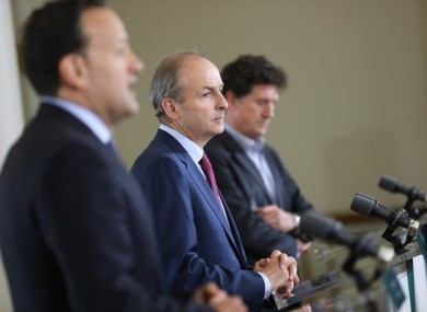 Taoiseach Micheál Martin, flanked by Tánaiste Leo Varadkar and Minister for Climate Action Eamon Ryan.