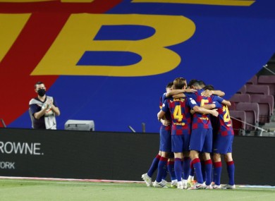 Barcelona's Luis Suarez celebrates with team-mates.