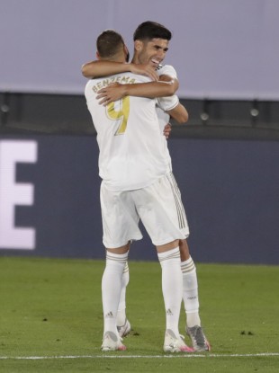 Karim Benzema celebrates with Marco Asensio after Real Madrid's second goal against Alaves.