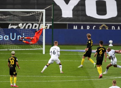 Swansea City's Andre Ayew (right) scores.