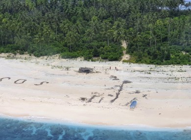 The men were missing for nearly three days when their SOS sign was spotted by searchers on Australian and US aircraft.