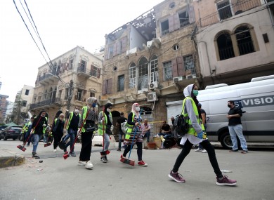 Volunteers out in groups to clean the destruction caused by last week's blast.