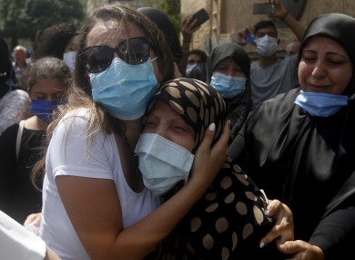 Relatives of Lebanese army lieutenant Ayman Noureddine, who was killed by Tuesday's explosion that hit the seaport of Beirut, mourn during his funeral procession today.