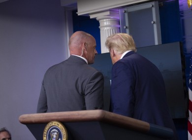 Trump was escorted from the room by a Secret Service agent.