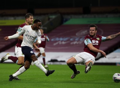 Raheem Sterling scores for Manchester City against Burnley despite the best efforts of Irish international Kevin Long.