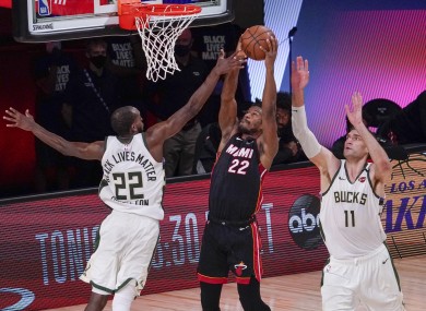 Jimmy Butler, centre, has revealed the Miami Heat will not be satisfied with anything less than the NBA championship.