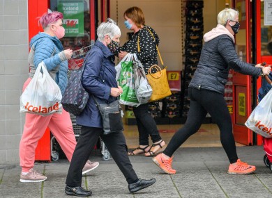 File image of people wearing face coverings in the UK.