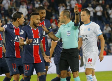 Neymar and team-mates argue with referee Jerome Brisard.