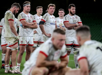 Ulster players stand by post-match. In the foreground, Ian Madigan consoles James Hume.