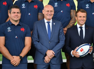 Laporte (centre) alongside Emmanuel Macron (right).
