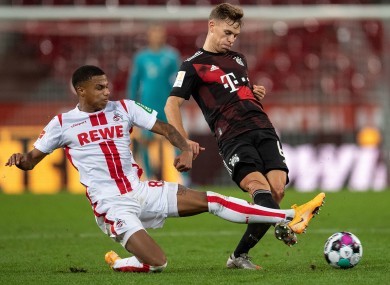 Cologne's Ismail Jakobs competes with Joshua Kimmich.