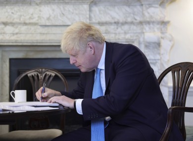 British Prime Minister Boris Johnson prepares his Brexit statement in his office at 10 Downing Street.