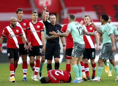 Everton’s Lucas Digne is shown a red card by referee Kevin Friend.