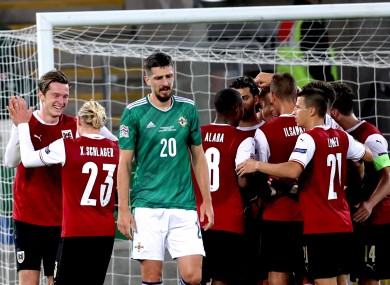 The Austrian players celebrate their winner.