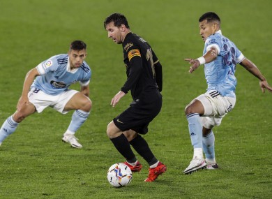 Lionel Messi under pressure against Celta Vigo.