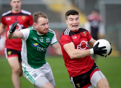 Aidan Breen challenges Down's Daniel Guinness.
