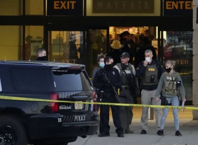 FBI officials and police stand outside the Mayfair Mall