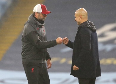 Liverpool manager Jurgen Klopp (left) and Manchester City manager Pep Guardiola after the final whistle.