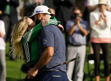 Dustin Johnson is hugged by his wife Pauline Gretzky after winning the Masters golf tournament.