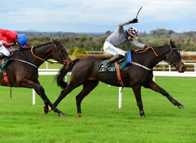 Castlegrace Paddy ridden by Bryan Cooper (right) wins the Tote Fortria Chase at Navan Racecourse.