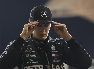 Mercedes driver George Russell walks from the track at Sakhir, Bahrain.