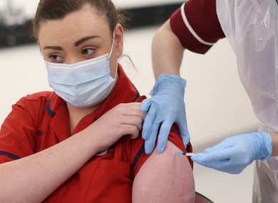 Sister Joanna Sloan becomes the first person in Northern Ireland to receive the first of two Pfizer/BioNTech Covid-19 vaccine jabs.