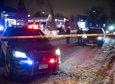 Police cars at the scene after a man was shot and killed by Minneapolis police at a petrol station