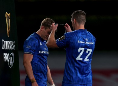 Johnny Sexton draping a man-of-the-match medal over Garry Ringrose after last season's Guinness Pro14 final.