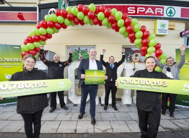 Staff and owner of the Spar in Mount Oval in Rochestown celebrate after they sold the winning ticket worth €10.7 million.