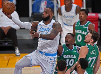 LeBron James scores in the first quarter against Dallas.