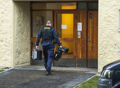 Police at the scene of the apartment in Stockholm.