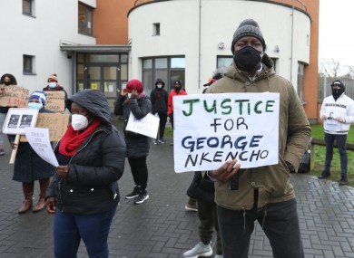 Protesters wearing face masks outside the Blanchardstown Garda Station in Dublin as they protest over the killing of George Nkencho.