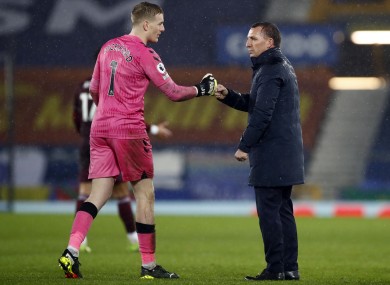 Everton goalkeeper Jordan Pickford with Leicester boss Brendan Rodgers.