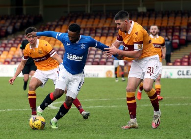 Rangers' Jermain Defoe and Motherwell's Declan Gallagher battle for possession.