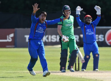 Rashid Khan (left) facing Ireland in 2018.