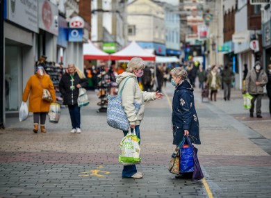 People chat on the High Street in Merthyr Tydfil.