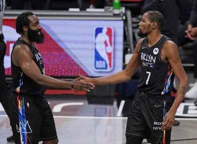 Kevin Durant congratulates Brooklyn Nets guard James Harden.