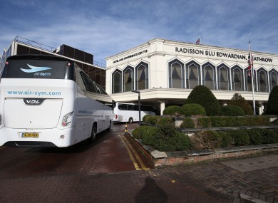 A coach carrying passengers arrives at the Radisson Blu Edwardian Hotel, near Heathrow Airport