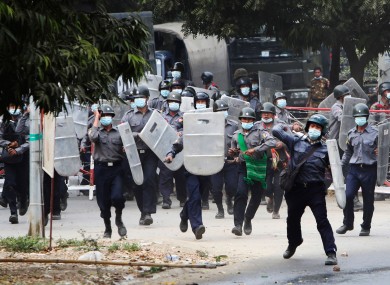 Police charge forward to disperse protesters in Mandalay, Myanmar