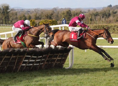 Beacon Edge, left, chases down Fury Road to win the Boyne Hurdle.