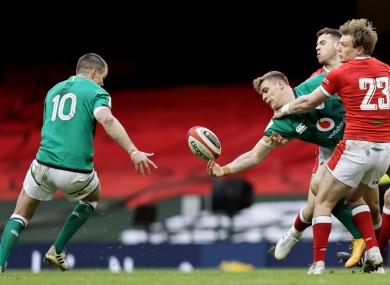 Garry Ringrose offloads to Johnny Sexton in Cardiff.