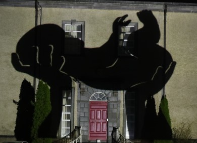 An image of a newborn baby is projected onto Sean Ross Abbey in Co Tipperary on St Brigid's Day as part of the Herstory Light Festival.