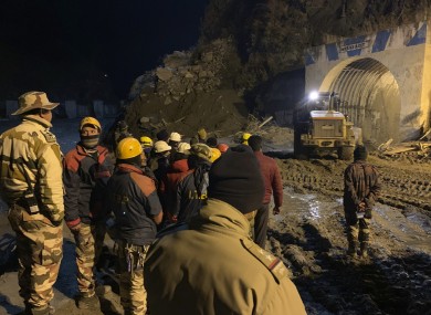 Police using heavy machinery to clear debris as they try to rescue more than three dozen power plant workers trapped in the tunnel