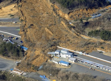A landslide caused by a strong earthquake covers a circuit course in Nihonmatsu city, Fukushima