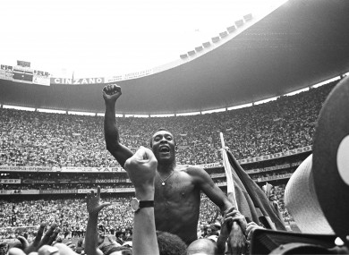 Pele is carried on the shoulders of fans through the stadium after the Brazil-Italy encounter at the 1970 World Cup.