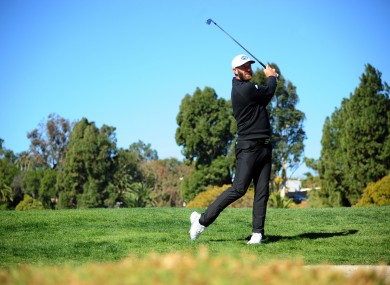 Dustin Johnson plays his shot.