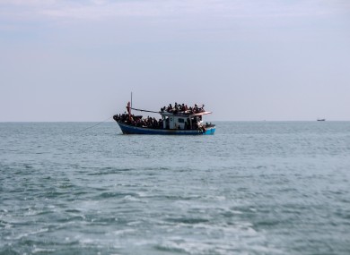 File photo - A wooden boat carrying dozens of Rohingya is seen visible as far as 1 kilometre from the coast in North Aceh Regency
